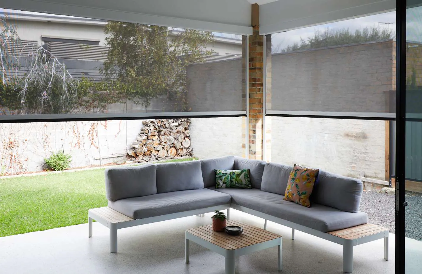Zipscreen blinds shading an outdoor lounge setting