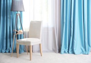 blue curtains maintaining a bright home decor