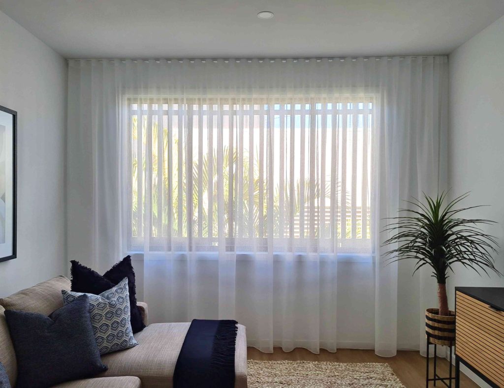 living area with white sheers and curtains gold coast